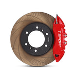 Close-up of a red TTSPORT GWM Cannon 7640TK 6-piston forged brake caliper for the front wheel and a slotted rotor.