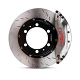 Close-up of a chrome TTSPORT PB6 6-piston watercooling forged brake caliper for the front wheel and a J-hock slotted 2-piece rotor.