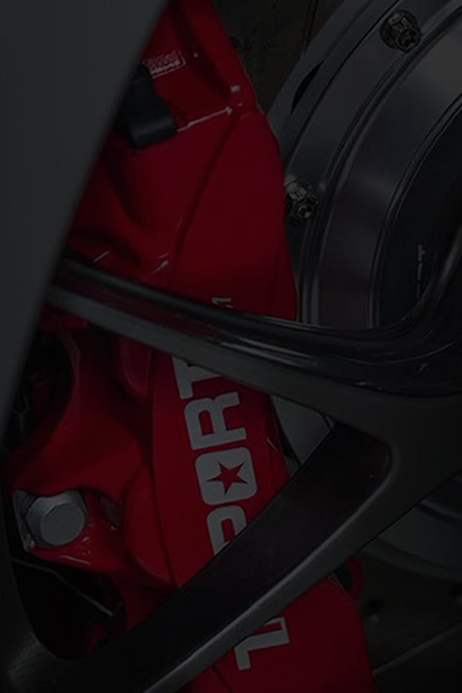 A red TTSPORT Classic Series 6-piston big brake kit.