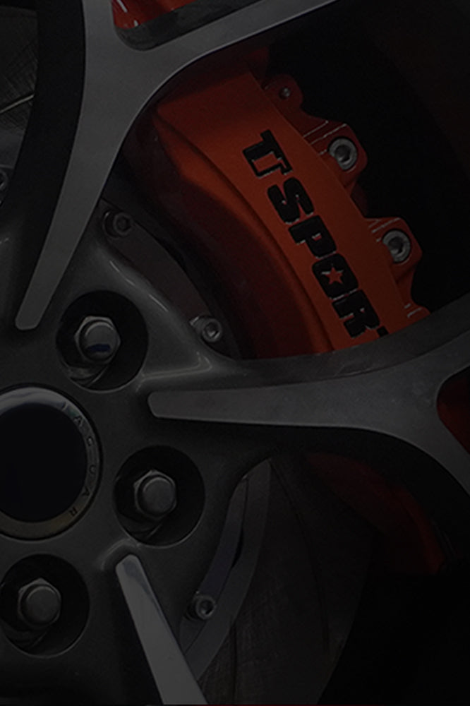 An orange TTSPORT Vehicle-Specific Series 6-piston big brake kit.