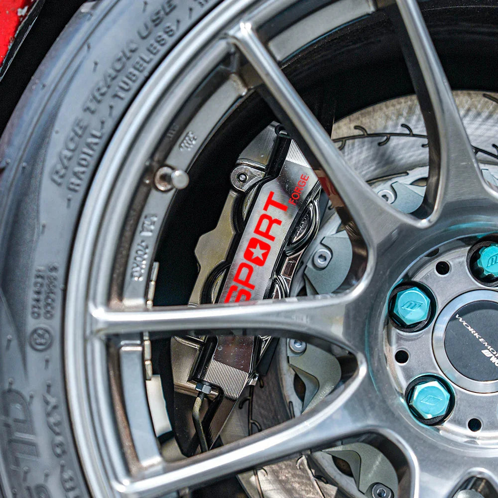 A red TTSPORT EMB4 4-piston big brake kit is installed on the 18" rear wheel.