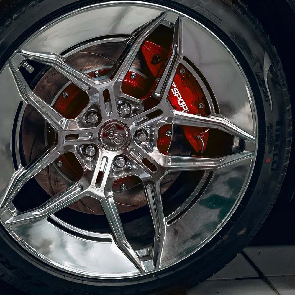 A red TTSPORT EP4S 4-piston big brake kit is installed on the 19" rear wheel.