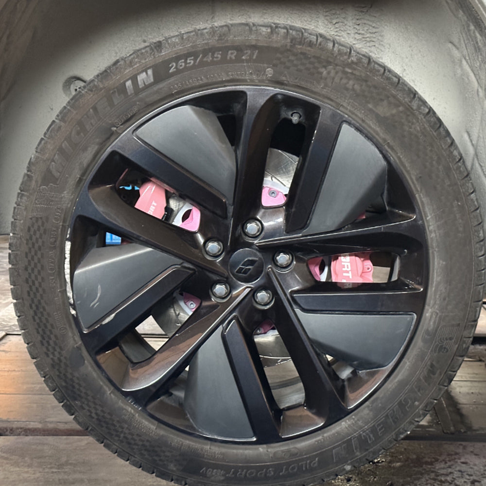A pink TTSPORT electronic parking brake (EPB) kit is installed on the rear wheel.