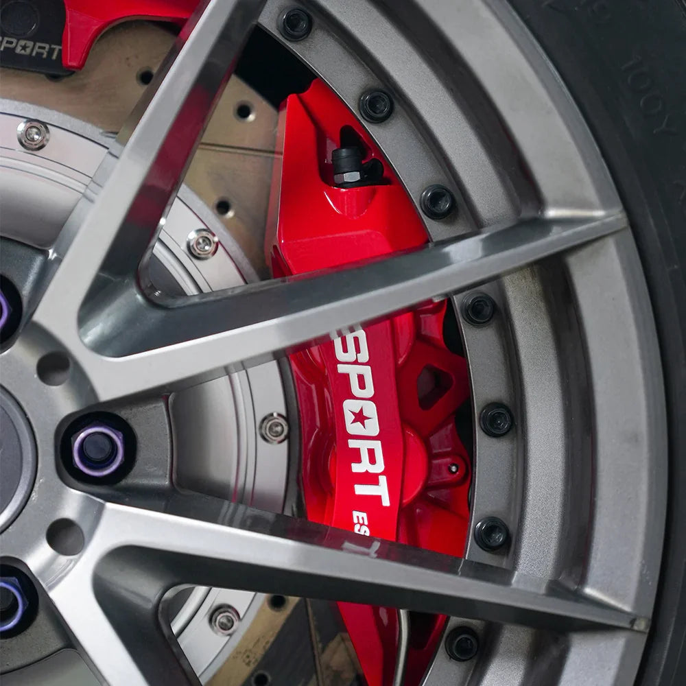 A red TTSPORT ES4 4-piston big brake kit is installed on the 18" rear wheel.