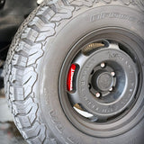 A red TTSPORT 7640TK 6-piston big brake kit is installed on the GWM Tank 500 front wheel.